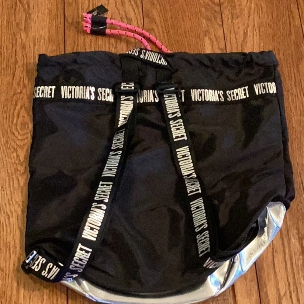 VICTORIA’S Secret black and silver backpack.